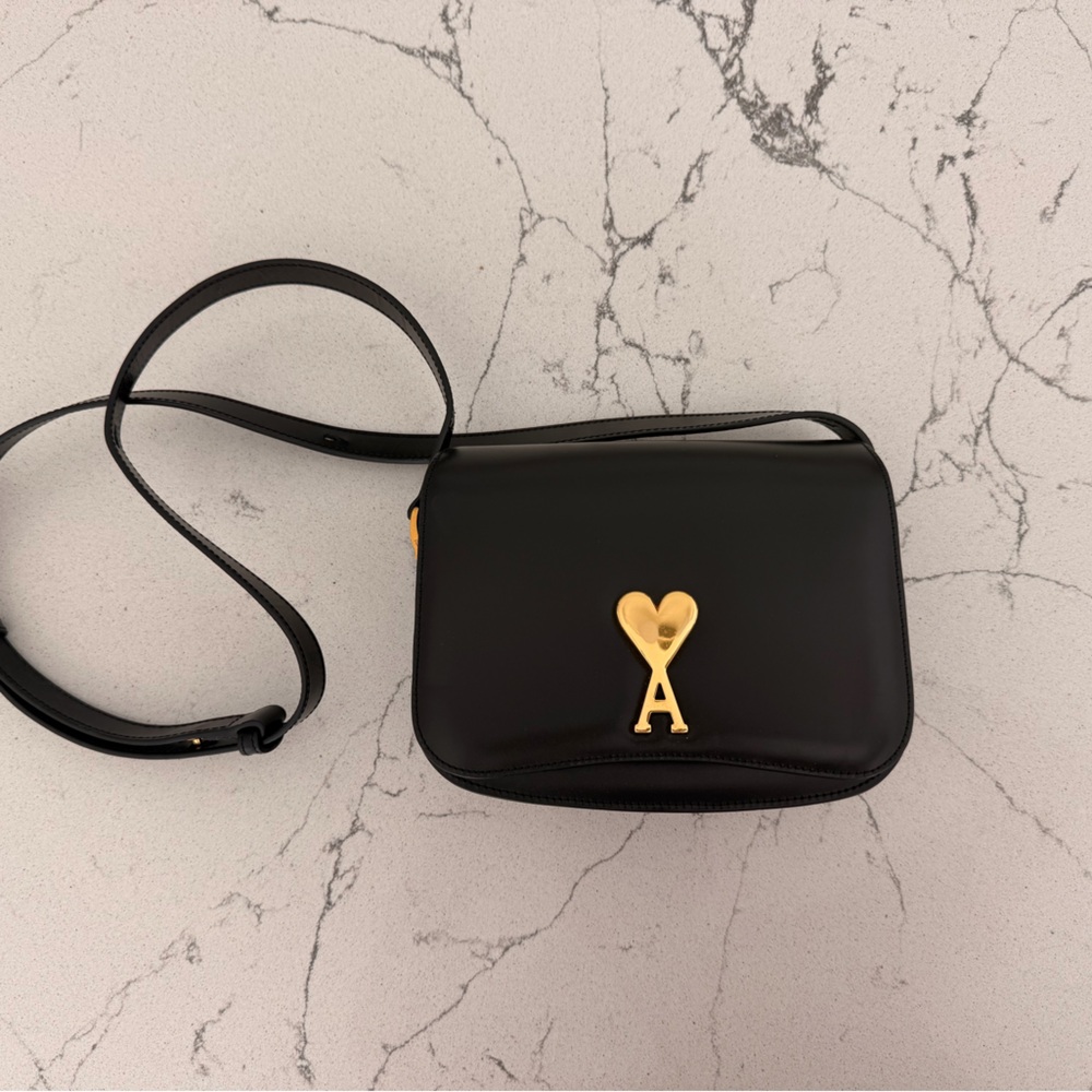 Elegant Black Crossbody Bag with Heart Accent